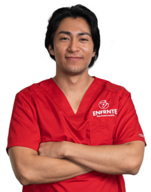young man with black hair wearing red scrubs crossing his arms